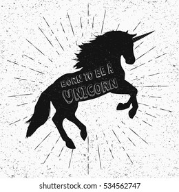 Born to be a unicorn. Vector illustration, eps10. Abstract unicorn silhouette isolated with text inside on grunge background. Black jumping fictional fairy animal.