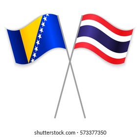 Bosnian and Thai crossed flags. Bosnia and Herzegovina combined with Thailand isolated on white. Language learning, international business or travel concept.