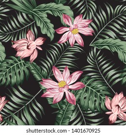 Botanical illustration green leaves and beautiful lily seamless vector pattern on the black background. Realisic beach wallpaper