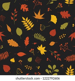 Botanical seamless pattern with autumn tree leaves and sprigs with berries on black background. Bright colored autumnal vector illustration in flat style for wrapping paper, backdrop, fabric print.