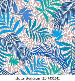 Botanical seamless pattern mixed with leopard spots skin print texture. Hand drawn fantasy exotic sprigs and leafage. Floral background made of herbal foliage leaves for fashion,  textile, fabric.