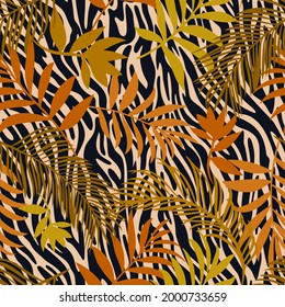 Botanical seamless pattern mixed with tiger zebra stripes skin texture. Hand drawn fantasy exotic sprigs and leafage. Floral background made of herbal foliage leaves for fashion, textile, fabric.