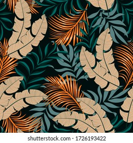 Botanical seamless tropical pattern with bright plants and leaves on a dark background. 
Summer colorful hawaiian seamless pattern with tropical plants. Seamless pattern with colorful leaves.