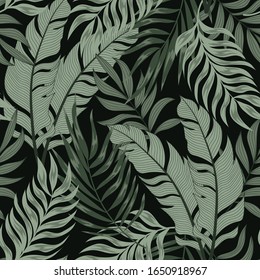 Botanical seamless tropical pattern with colorful plants and leaves on a black background. Colorful stylish floral. Exotic tropics. Summer. Hawaiian style.