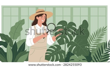 Botanist with a sun hat examines large tropical leaves with a magnifying glass.