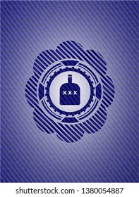 bottle of alcohol icon inside badge with jean texture