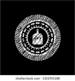 bottle of alcohol icon inside chalk emblem written on a blackboard