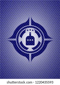 bottle of alcohol icon inside emblem with denim high quality background