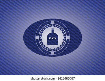 bottle of alcohol icon inside emblem with denim high quality background