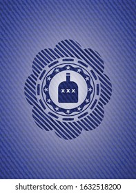 bottle of alcohol icon inside emblem with denim high quality background