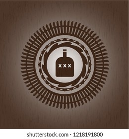 bottle of alcohol icon inside realistic wood emblem