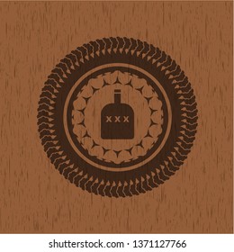 bottle of alcohol icon inside realistic wooden emblem