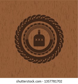 bottle of alcohol icon inside retro style wooden emblem