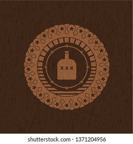 bottle of alcohol icon inside retro wood emblem