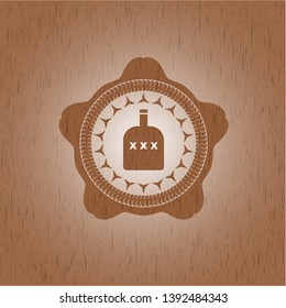 bottle of alcohol icon inside retro wood emblem