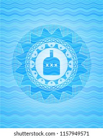 bottle of alcohol icon inside water concept badge.