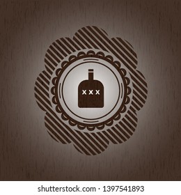 bottle of alcohol icon inside wooden emblem