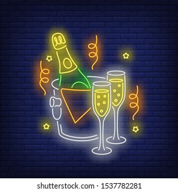 Bottle of champagne in ice bucket neon sign. Glowing neon glasses, bottle, ice bucket. New year, Christmas, winter. Vector illustration in neon style for greeting card, invitation, announcement