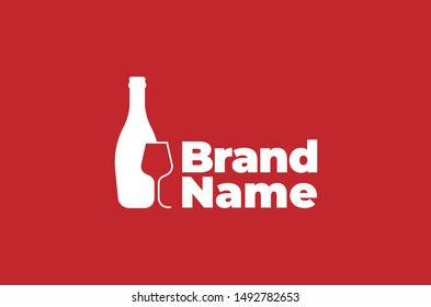 Bottle with glass in front shown in negative space