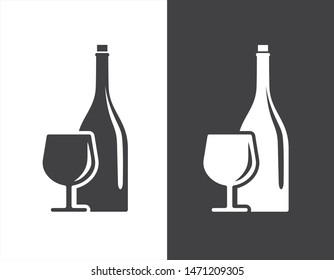Bottle and glass vector illustration with black and white design suitable for drinks icon or logo. Bottle and glass silhouette design.