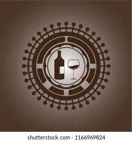 bottle and glass of wine icon inside wooden emblem. Retro