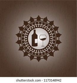 bottle and glass of wine icon inside wood emblem
