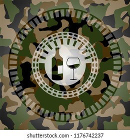 bottle and glass of wine icon inside camo emblem