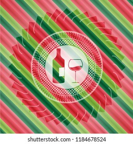 bottle and glass of wine icon inside christmas style emblem.