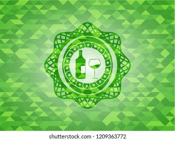 bottle and glass of wine icon inside green emblem with mosaic background