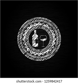 bottle and glass of wine icon inside chalkboard emblem