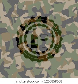 bottle and glass of wine icon inside camo emblem