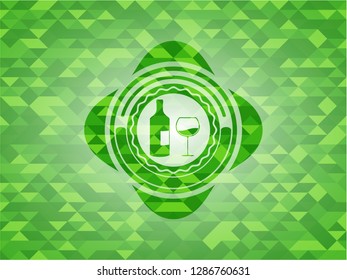 bottle and glass of wine icon inside green emblem. Mosaic background