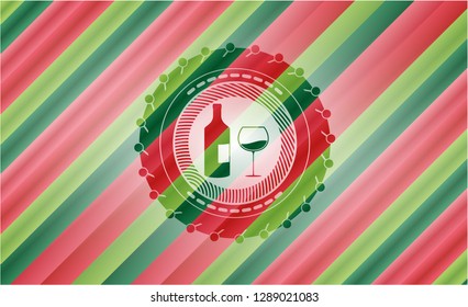 bottle and glass of wine icon inside christmas colors emblem.