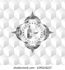 bottle and glass of wine icon inside grey icon or emblem with geometric cube white background