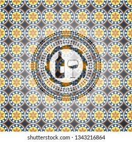 bottle and glass of wine icon inside arabesque style badge. arabic decoration.