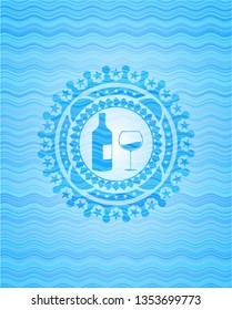 bottle and glass of wine icon inside water wavec oncept emblem.