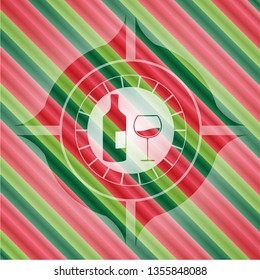 bottle and glass of wine icon inside christmas colors badge.