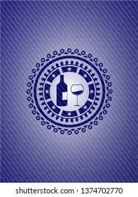 bottle and glass of wine icon inside badge with jean texture
