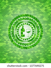 bottle and glass of wine icon inside realistic green emblem. Mosaic background
