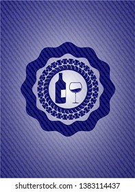 bottle and glass of wine icon inside emblem with jean high quality background