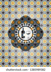 bottle and glass of wine icon inside arabic emblem background. Arabesque decoration.