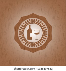 bottle and glass of wine icon inside retro wooden emblem