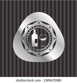 bottle and glass of wine icon inside silvery badge or emblem