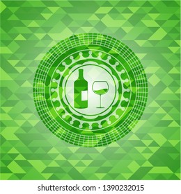 bottle and glass of wine icon inside green emblem with triangle mosaic background