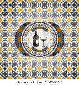 bottle and glass of wine icon inside arabic emblem. Arabesque decoration.