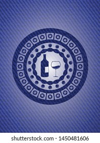 bottle and glass of wine icon inside badge with denim texture