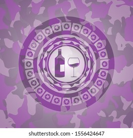 bottle and glass of wine icon inside pink and purple camouflaged emblem