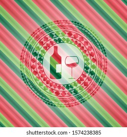 bottle and glass of wine icon inside christmas colors badge.