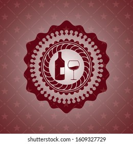bottle and glass of wine icon inside red icon or emblem