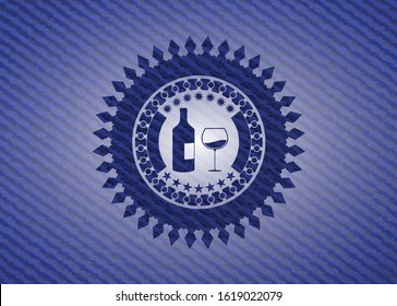 bottle and glass of wine icon inside emblem with jean texture